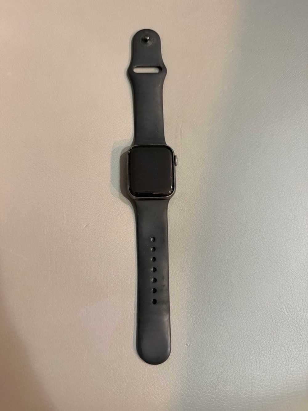 Apple Watch Series 4 40mm with Black silicone band and charging cable